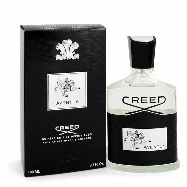 Creed Aventus Eau de Parfum 100ml bottle next to its black packaging box, featuring the iconic Aventus horse logo and black and white design on a white background.
