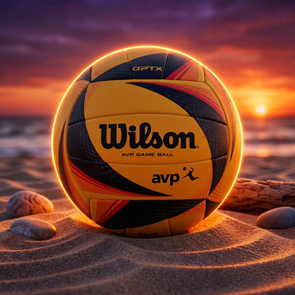 Wilson volleyball on a beach with a sunset in the background