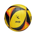 A yellow, black, and orange handball with the 'avp' logo printed on the front, shown against a plain white background.